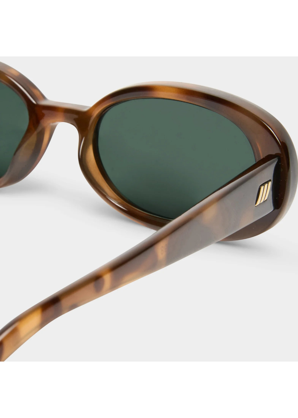 Le Specs Outta Love in Tort Green Mono